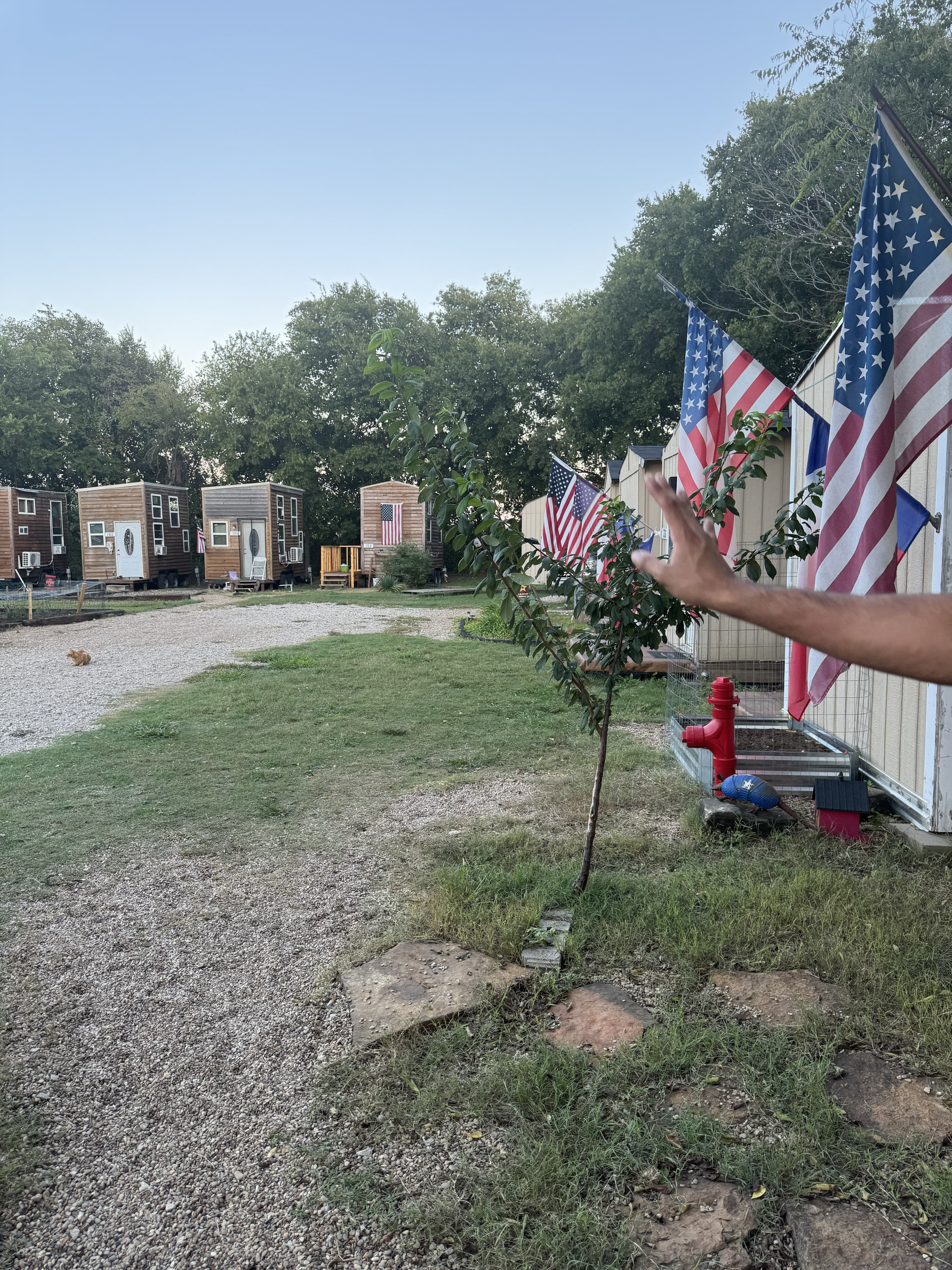 Tiny houses with flags at Serenity Village