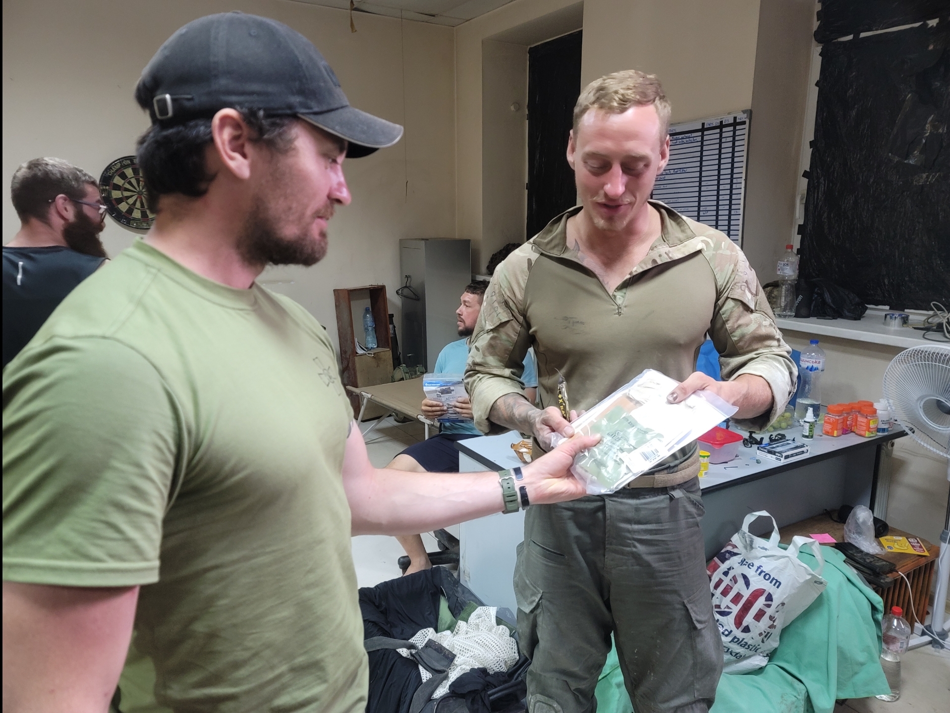 Handing medical supplies to a soldier in Ukraine